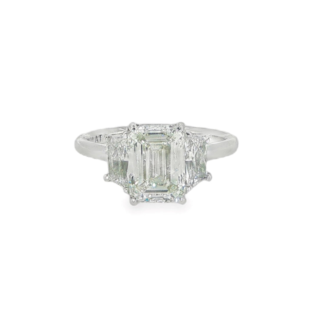 Platinum Three Stone Engagement Ring With An Emerald Cut Center Stone And Trapezoid Side Stones - Size 6.25