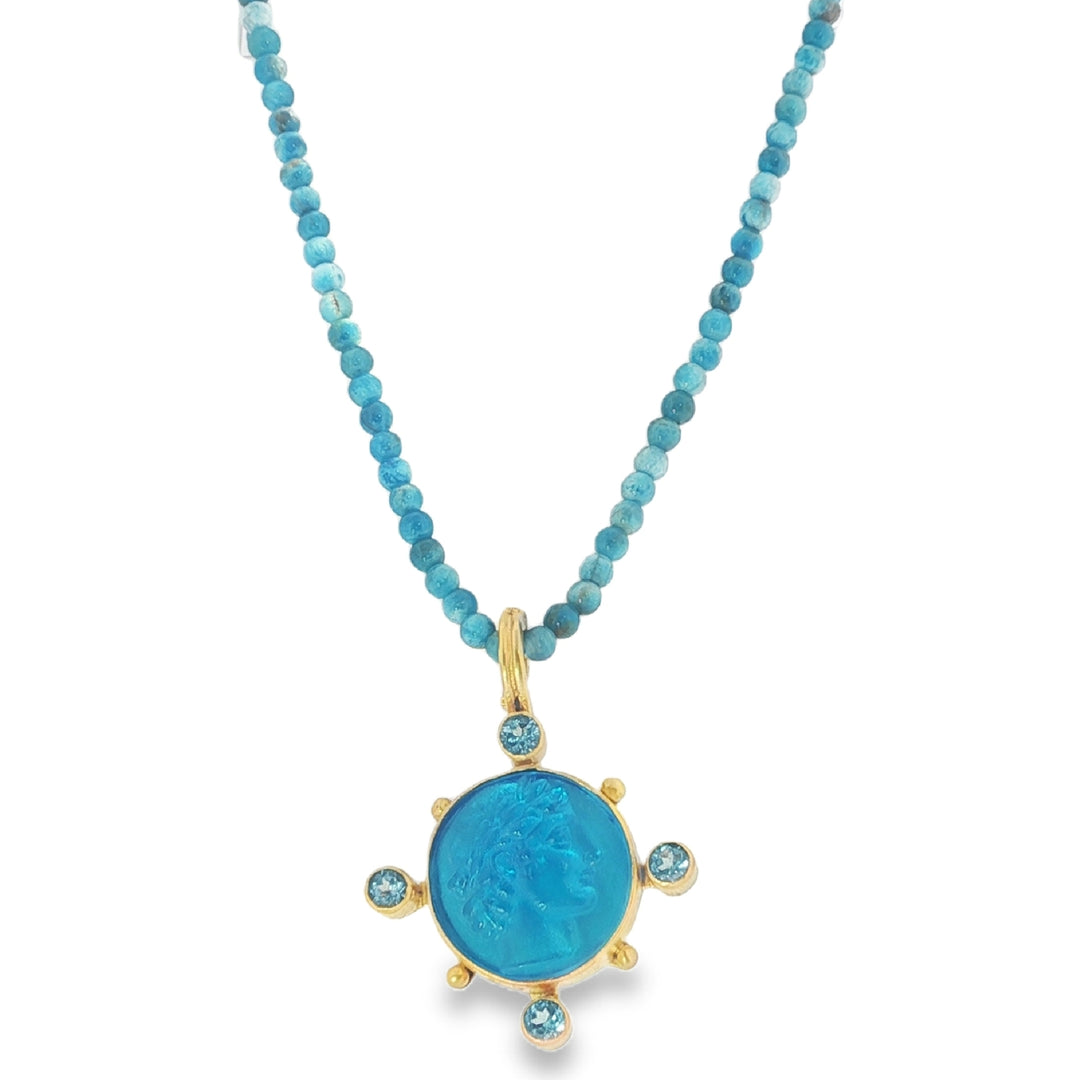 Blue Topaz Apollo Enhancer On A Blue Beaded Necklace