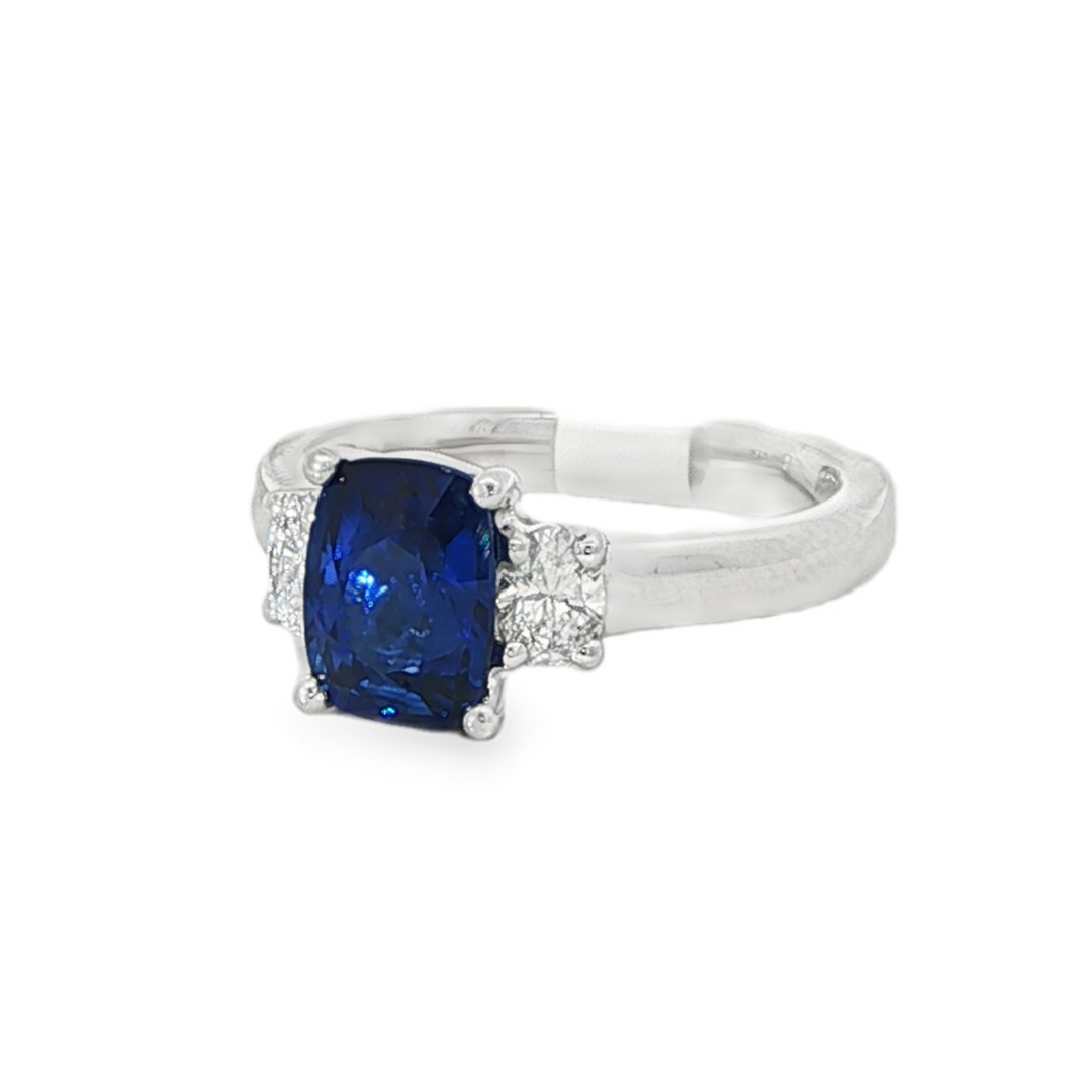 Platinum Three Stone Ring With A Cushion Cut Ceylon Sapphire and Oval Diamond Side Stones - Size 6.5