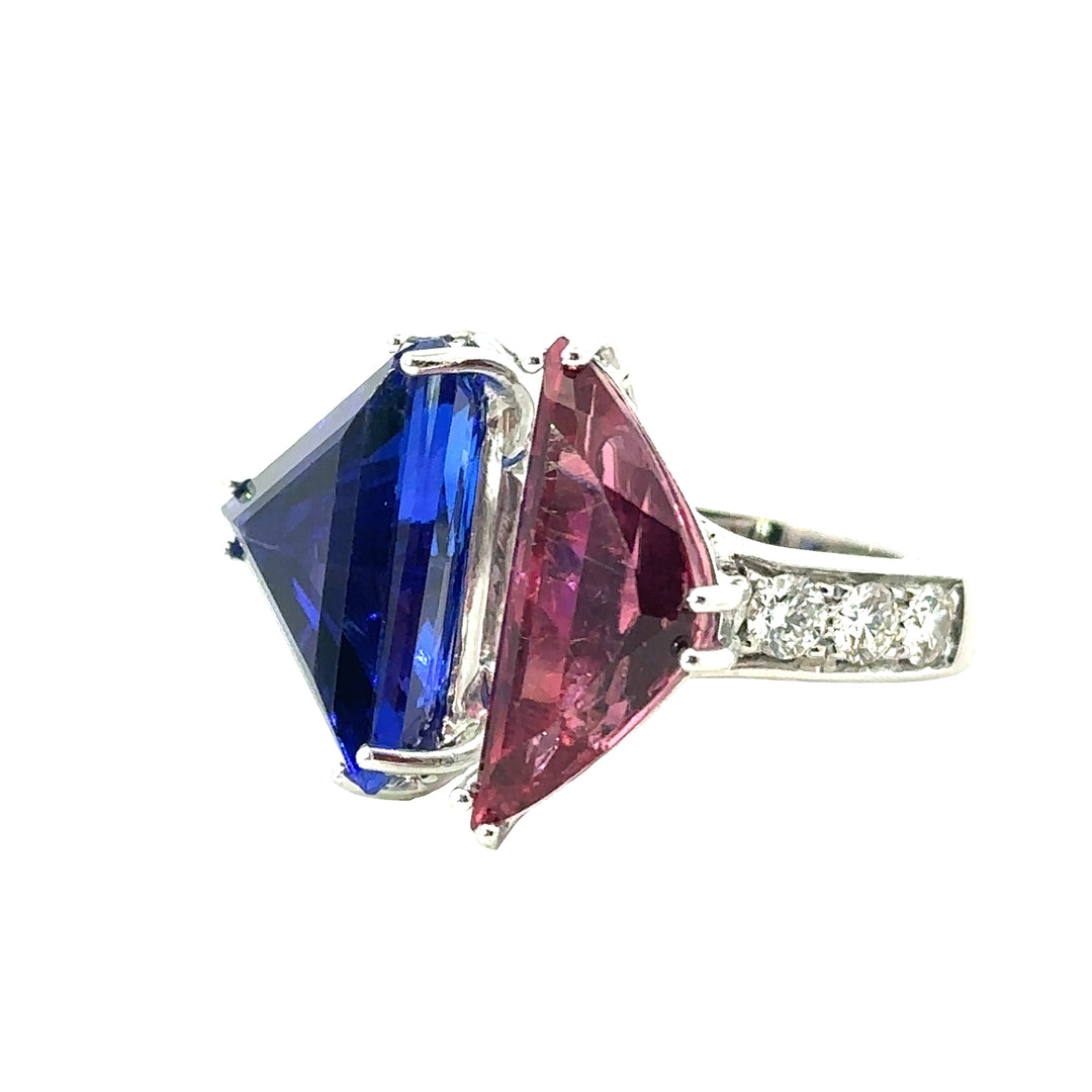 18K White Gold Ring With A Trillian Cut Tanzanite And A Trillian Cut Pink Tourmaline And Round Diamonds Along The Band - Size 6