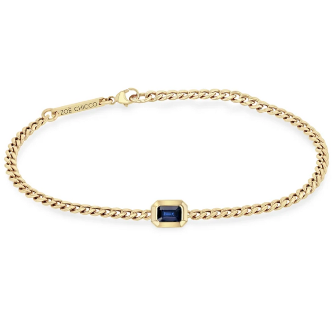 14K Yellow Gold Curb Chain Bracelet With An Emerald Cut Blue Sapphire - 6.5"