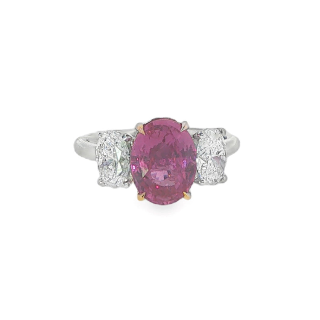 Platinum Three Stone Ring With Oval Diamond Side Stones And A Center Oval Pink Sapphire - Size 6.25