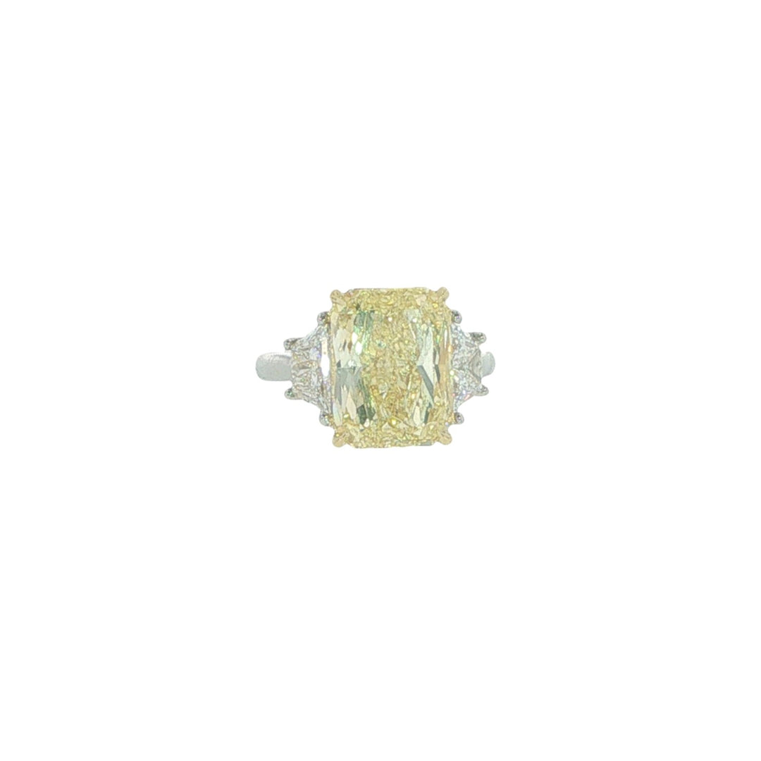 18K White Gold And Platinum Radiant Cut Fancy Yellow Diamond Ring Accented By Two Trapezoid Diamonds - Size 6.25