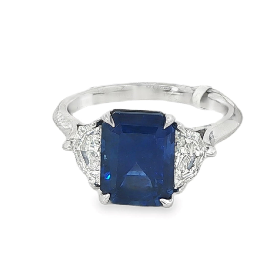 Platinum Ring With Blue Sapphire Center Stone and 2 Cadillac Diamond Side Stones - Size 6.25