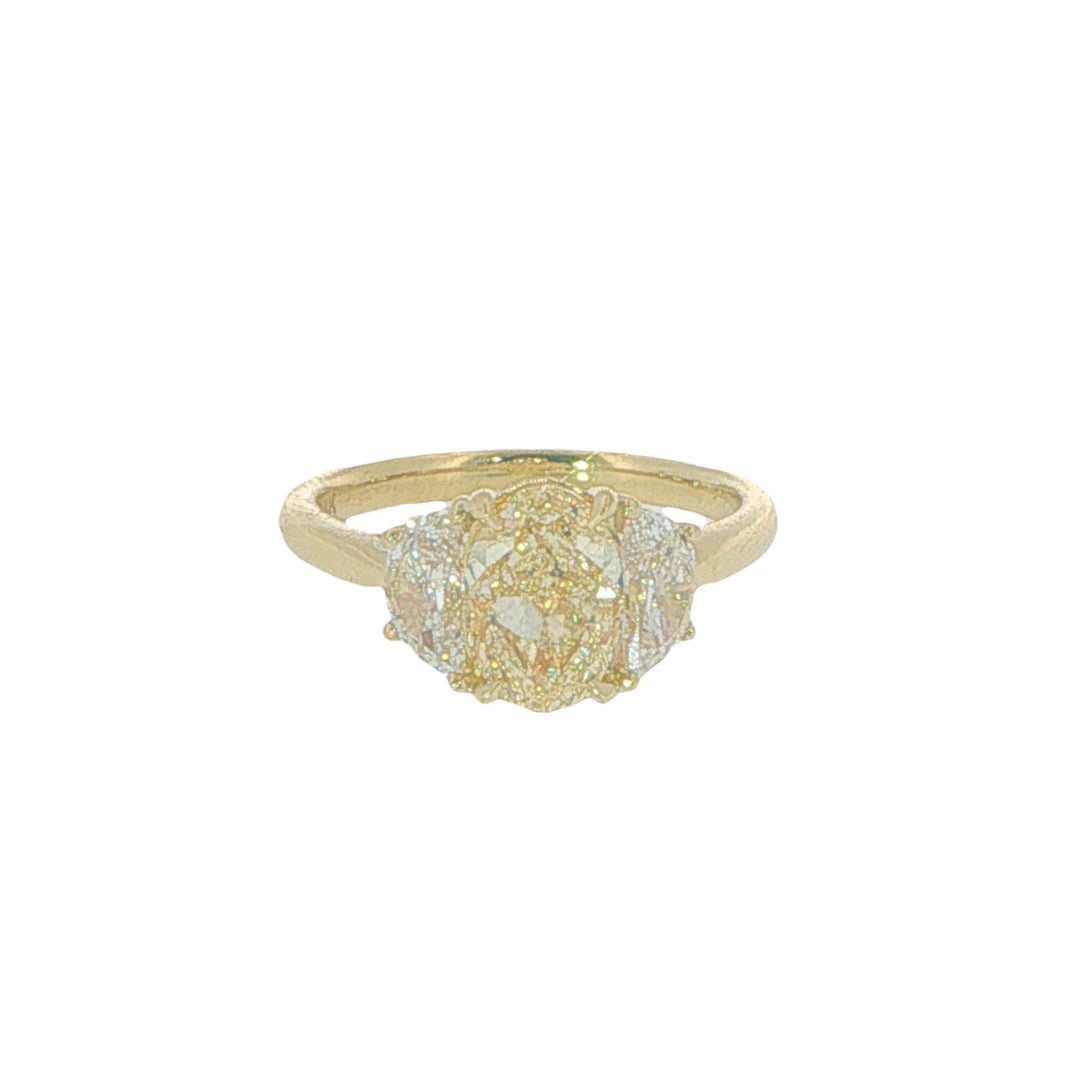 18K Yellow Gold Engagement Ring With An Oval Fancy Light Yellow Diamond And Two Half Moon Side Stones - Size 6.5
